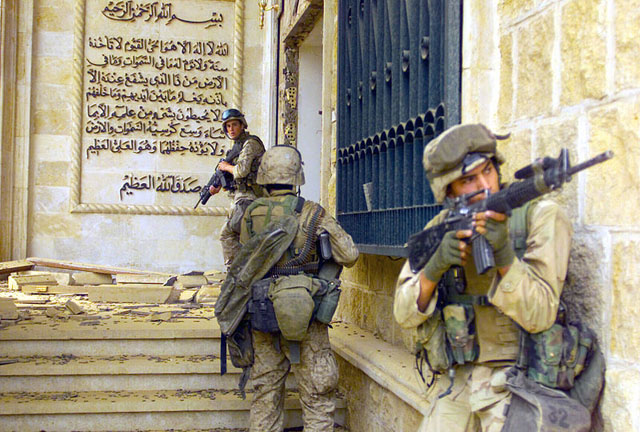 U.S. Marines entering one of Saddam Hussein's palaces during Operation Iraqi Freedom, 2003.